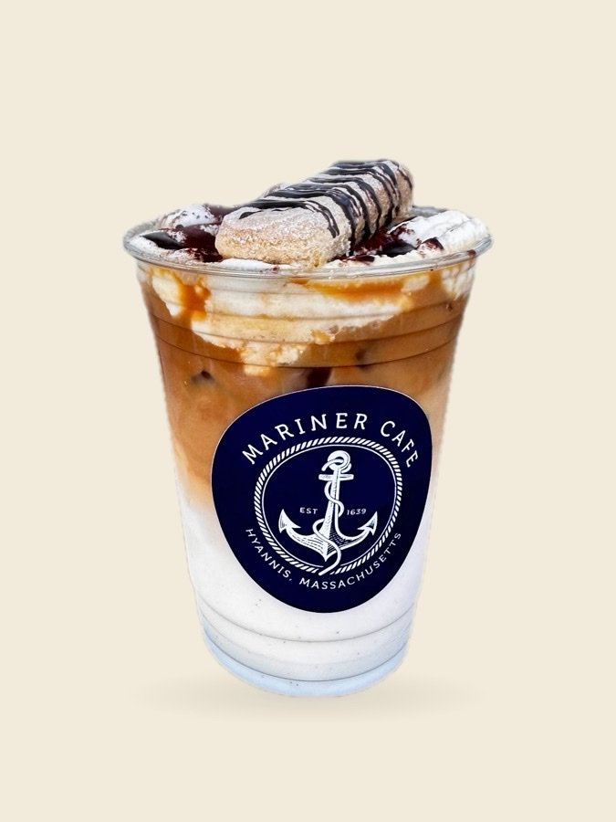 An iced coffee from Mariner Cafe in Hyannis, topped with whipped cream and a ladyfinger